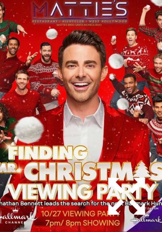 A group of people walking down a dimly lit staircase in an urban setting at night, capturing nightlife ambiance.